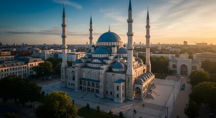 Obraz premium Aerial View of a Mosque at Sunrise in Urban Setting