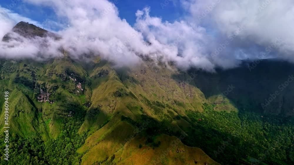 Poster bukit selong viewpoint with clouds rolling over dramatic green ridges in aerial view