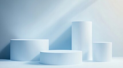 Light blue cylindrical display podiums for product presentation.