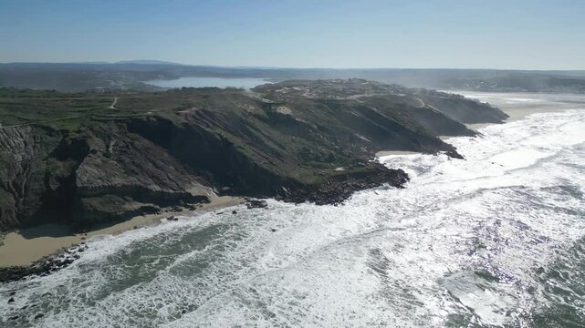 Majestic ocean cliffs at Miradouro do Salgado in Nazar&eacute;, Portugal on a sunny day