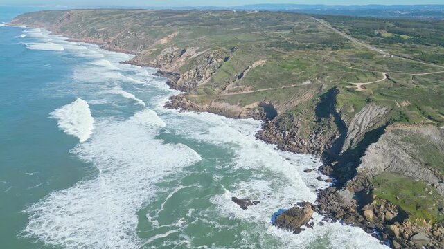 Cliffs and ocean waves at Miradouro do Salgado viewpoint, Nazar&eacute;, Portugal