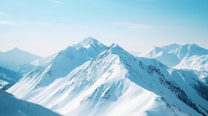 Snowy mountain peaks under a clear sky.
