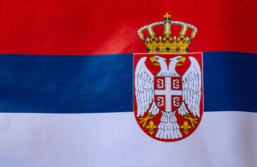 Serbian flag with the coat of arms, full frame