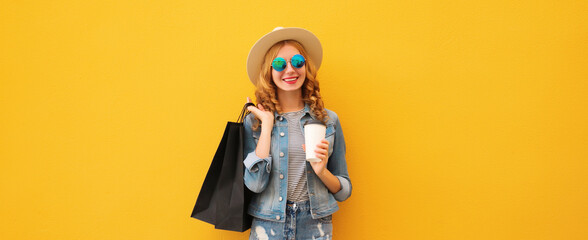 Shopping day! Stylish beautiful happy smiling young woman with black shopping bags, wear summer hat