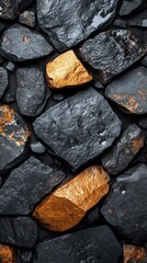 Stone wall texture with dark gray and brown rocks close up.
