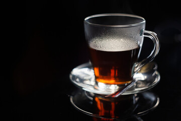 cup of tea close focus black background