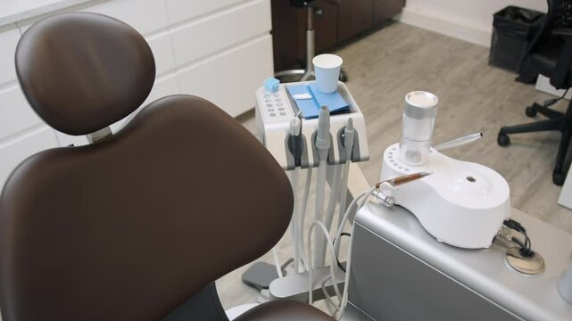 Dentist chair and modern equipment, close up motion view