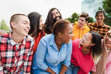 Group of happy multiracial people smiling on camera with city in background - Diversity, multiethnic and people lifestyle concept - Main focus on curvy african woman face