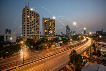 Fototapeta premium Urban skyline at dusk with light trails and modern architecture.