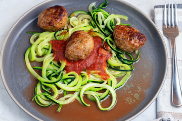 zucchini noodles with pasta sauce and meat balls