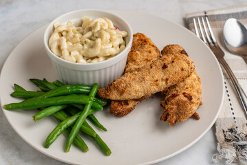chicken  tenders with green beans and macaroni salad
