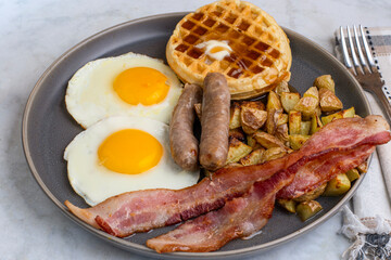 fried eggs with waffles  top with melted butter and  syrup