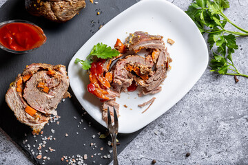 Well-cooked shredded meat garnished with herbs and sauce on a white plate. Perfect for food-related stock photography, cooking tutorials, and marketing visuals