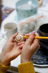 The process of painting Easter eggs, using bees wax as traditional Lithuanian method