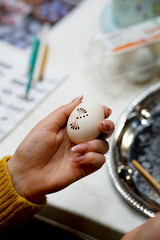 The process of painting Easter eggs, using bees wax as traditional Lithuanian method
