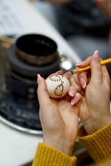 The process of painting Easter eggs, using bees wax as traditional Lithuanian method