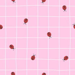 Cute vector seamless pattern with lady bugs on a pastel pink checkered background. Girly background with ladybug beetles in trendy color palette in minimalist style
