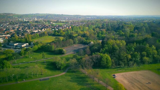 Aerial of Ormeau Park in Belfast, Northern Ireland on a warm, sunny summer day. The camera passes over the park and the tennis courts. Filmed in 4K, 60 frames per second and in Rec709 Color.