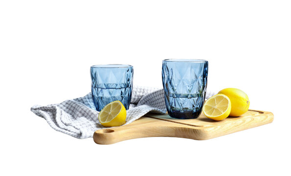 Blue glasses with water and lemons