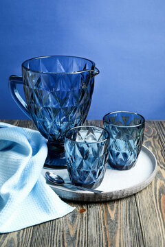 Blue faceted jug, glasses and plate