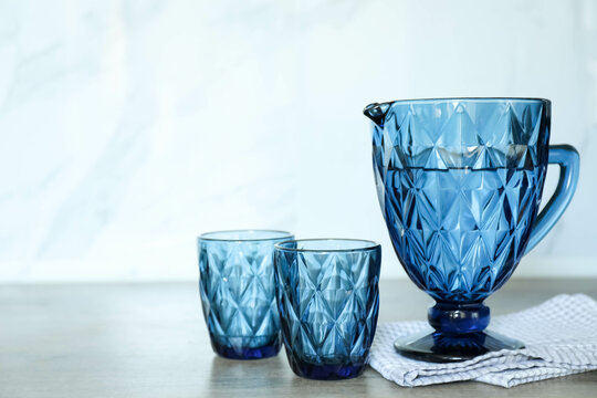 Blue faceted jug and glasses filled with water