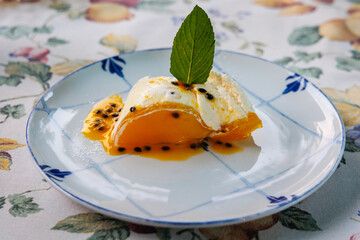 Cheesecake with passion fruit sauce in Funchal city, capital of Madeira Island, Portugal