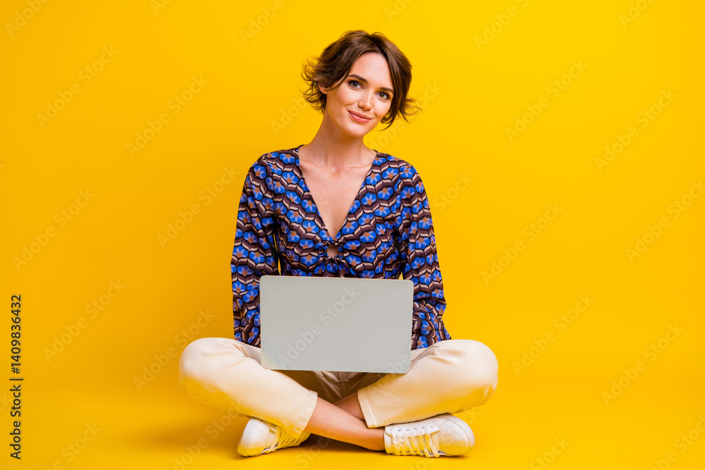 Poster full length body photo of young lady sitting floor with netbook doing her job in remote location iso