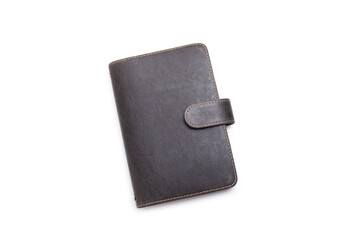 A closed leather agenda isolated on a white background
