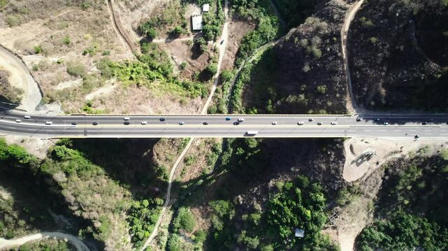 Establishing Aerial Top Down Shot of Caracas La Guaira Highway Viaduct. Modern highway in Latin America, one of the largest made of concrete