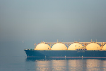 LNG tanker ship, with visible specific ball shaped tanks, anchored near entrance to the port of...