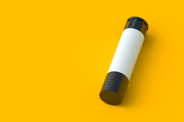 One glue stick on yellow background. School equipment. Office supplies. Accessories for handcraft. Copy space. 3d render