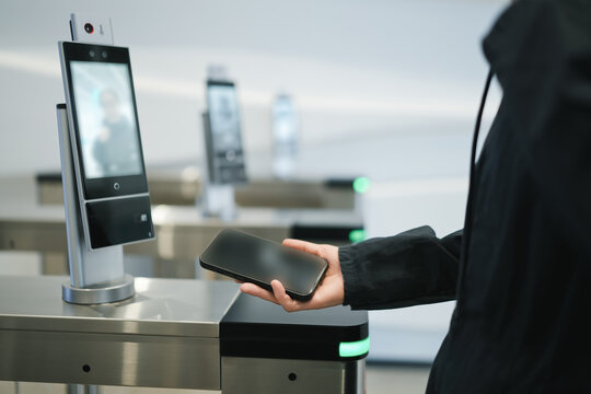 User Engaging with High-Tech Access Control System at Security Checkpoint - Powered by Adobe