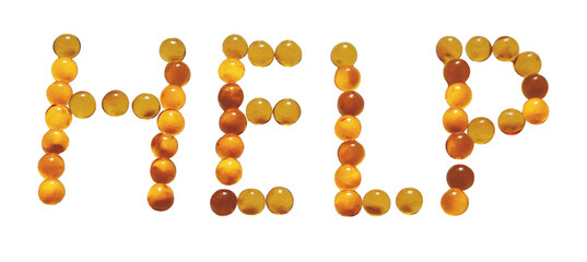 The word help laid out in pills