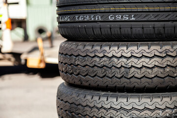 Stack of new and used car tyres