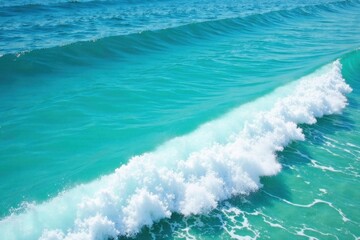 Foam- covered ocean waves on a clear blue turquoise sea, natural texture, calm sea, ocean surface