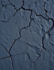 Obraz premium Rough, dark gray stone texture with deep grainy crevices and uneven surface, rugged, close-up, granite