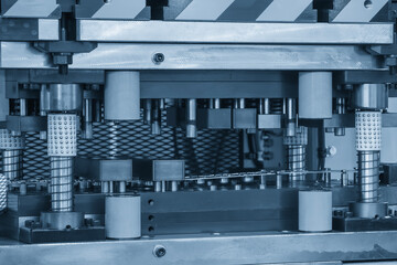 The metal forming process by progressive die in the light blue scene.