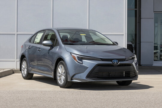 Toyota Corolla Hybrid LE AWD Sedan at a dealership. Toyota offers the Corolla with a 1.8L 4-Cylinder Hybrid engine. MY:2025
