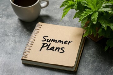 Summer Plans Notebook on Table with Coffee Cup and Green Plant for Seasonal Inspiration