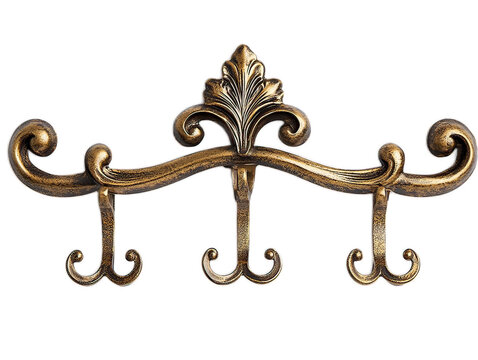 Decorative metal wall hooks with antique brass finish and ornate design, isolated on white background