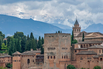 Alhambra palace complex with Sierra Nevada mountains in background, Granada, Spain