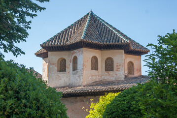 Moorish architecture with tiled roof and ornate windows, Alhambra, Granada, Spain