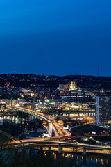 over view of city highways at night view of the city light of cars on road ways
