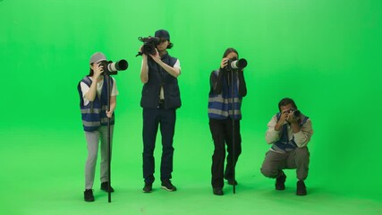 Green Screen Chroma Key Background: Team of Phototgraphers and Cameraman, Capturing Sport News Event With Cameras. Championship Event for Racing, American Football, Soccer, Basketball