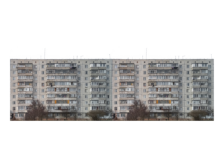 Nine-storey panel apartment building with enclosed balconies is isolated.