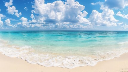 Obraz premium A beautiful blue ocean with a few clouds in the sky. The sky is clear and the water is calm