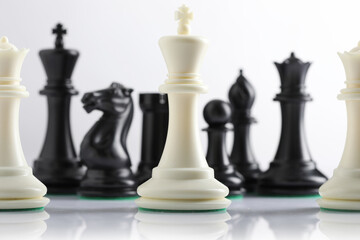chess pieces on chessboard on marble background. game of chess