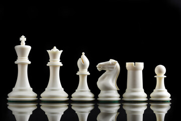 chess pieces on chessboard on marble background. game of chess