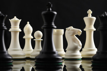 chess pieces on chessboard on marble background. game of chess