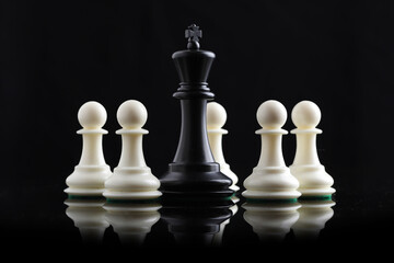 chess pieces on chessboard on marble background. game of chess